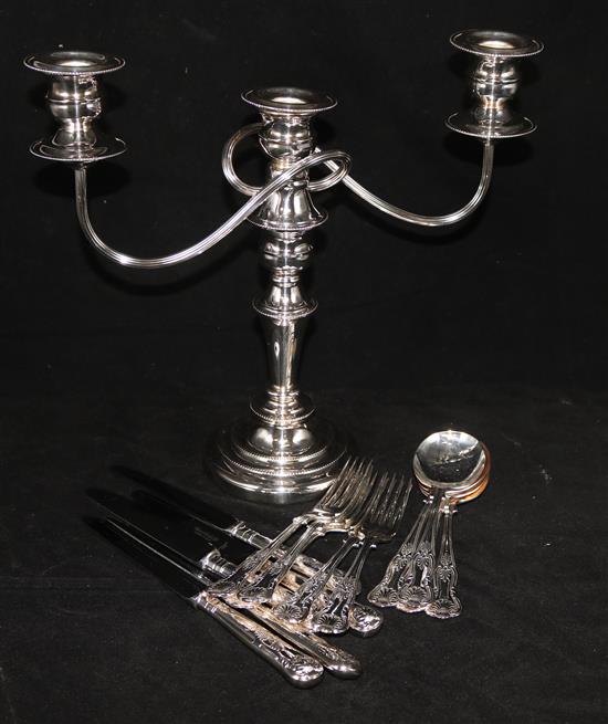 Silver plated cutlery and a two branch candelabra